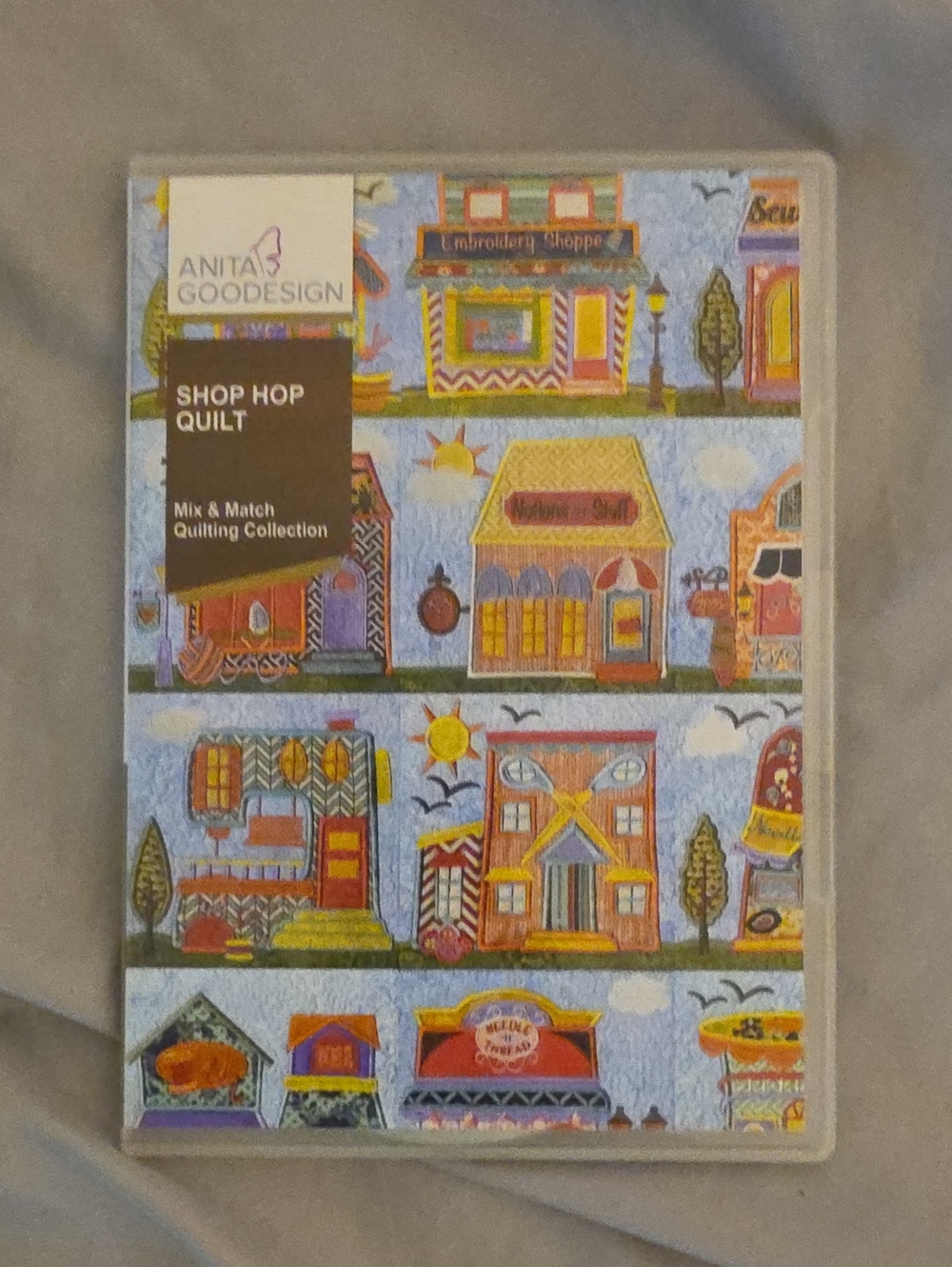 Anita Goodesign Shop Hop Quilt Pattern - Colorful Village Print